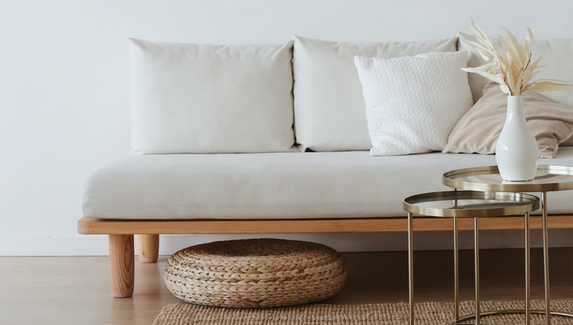 a living room with a white couch and a coffee table.