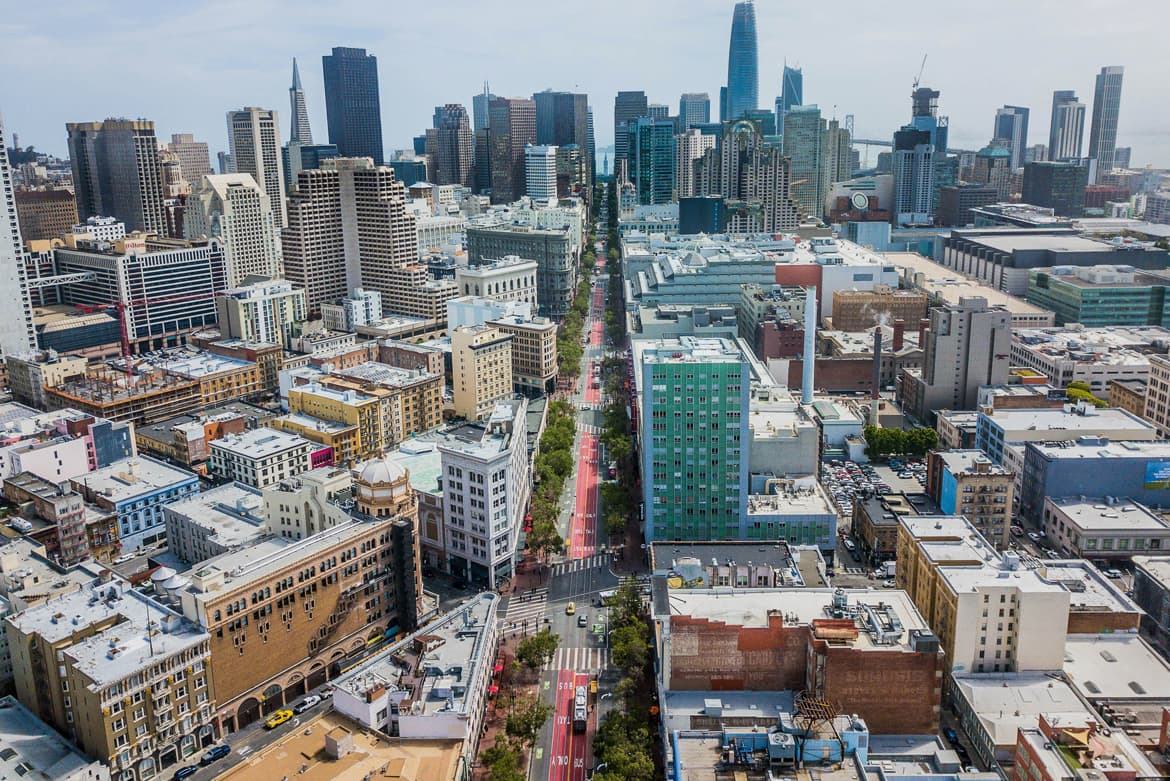 an aerial view of a city with tall buildings.