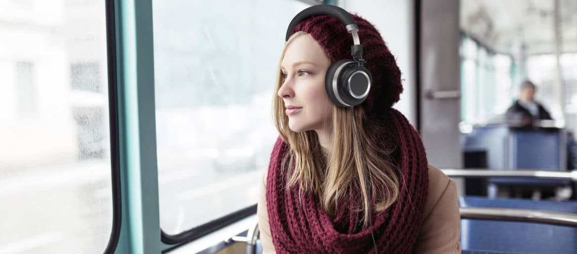 A digital nomad listening to podcasts while sitting on a bus.