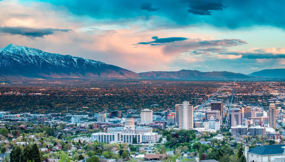 A breathtaking view of a digital nomad city nestled among majestic mountains.