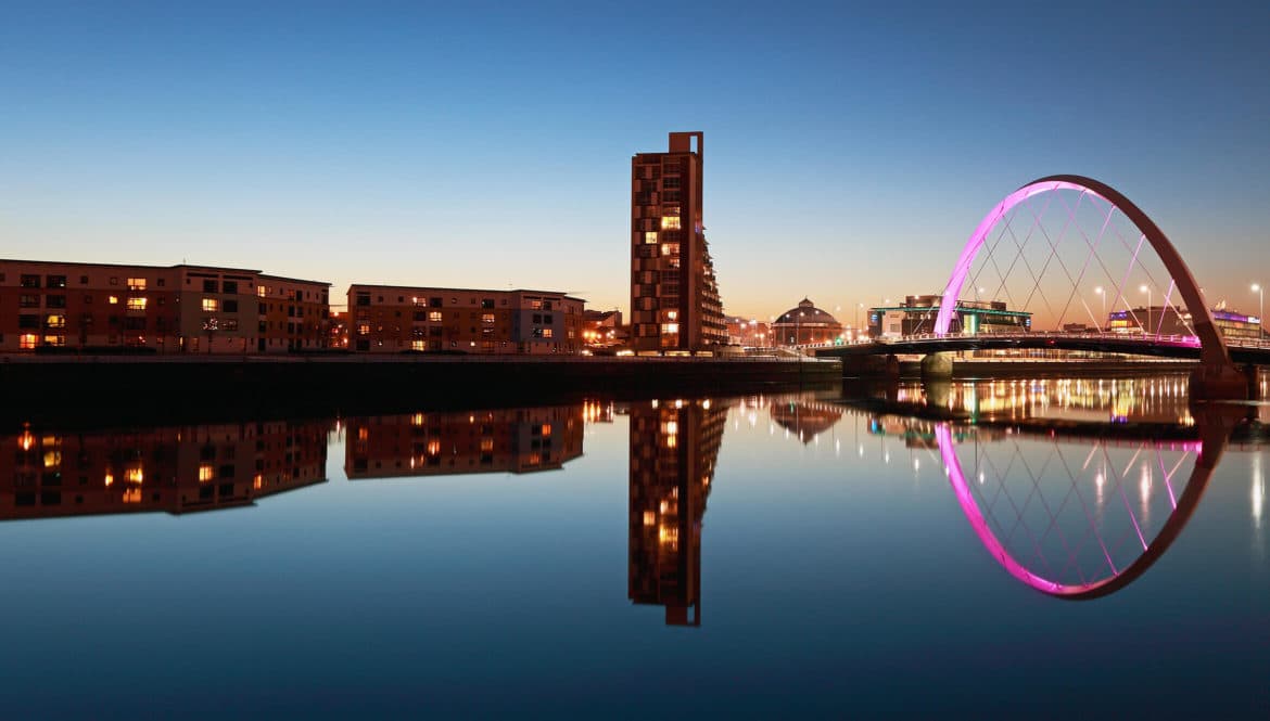 A picturesque bridge over a serene body of water, perfect for satisfying one's wanderlust.