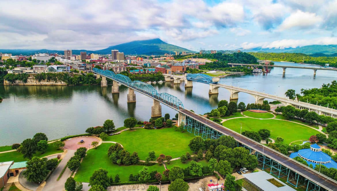 an aerial view of a bridge over a river.