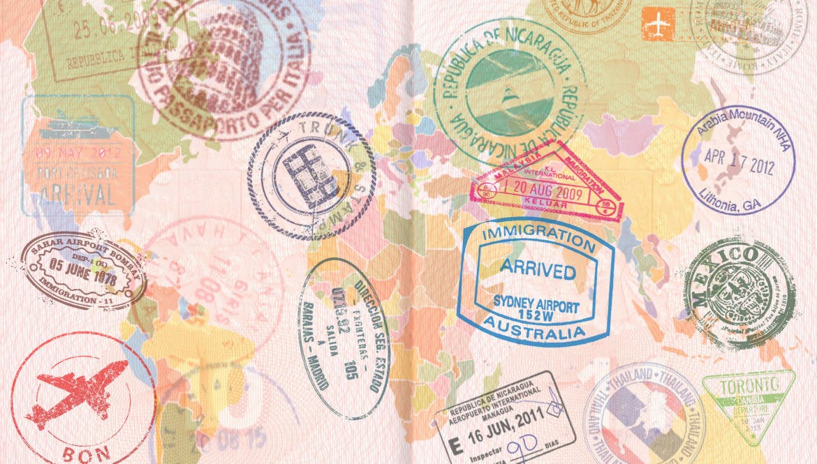 A passport with digital nomad visa stamps on it.