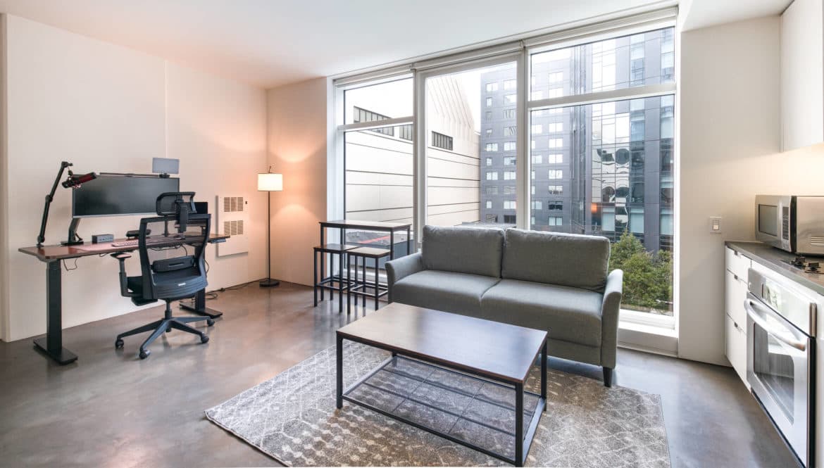 a living room filled with furniture and a flat screen tv.