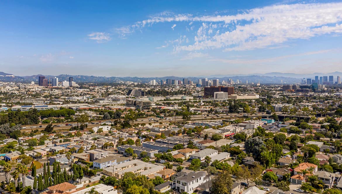 an aerial view of a city with tall buildings.