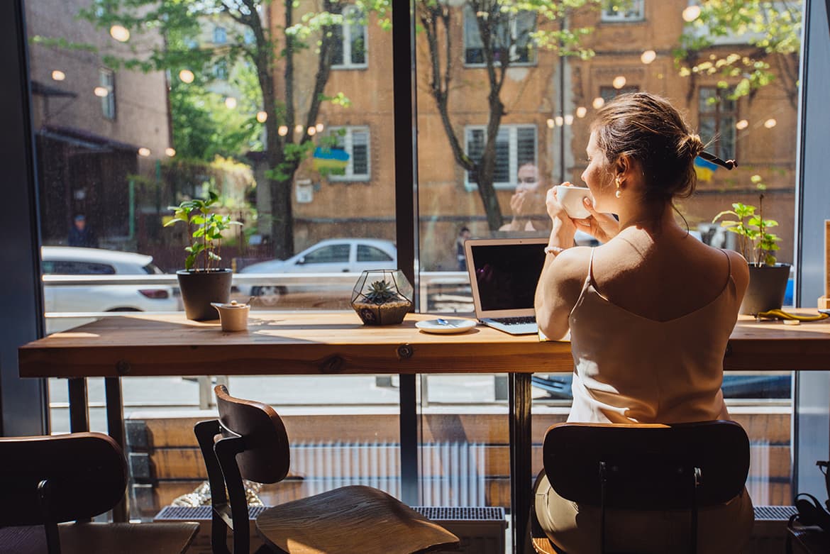 A woman working anywhere with a laptop.